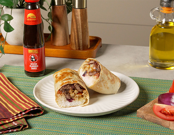 A lomo saltado burrito, filled with Peruvian lomo saltado.