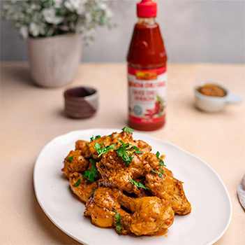 A marry me chicken recipe used for wings with Lee Kum Kee Sriracha.
