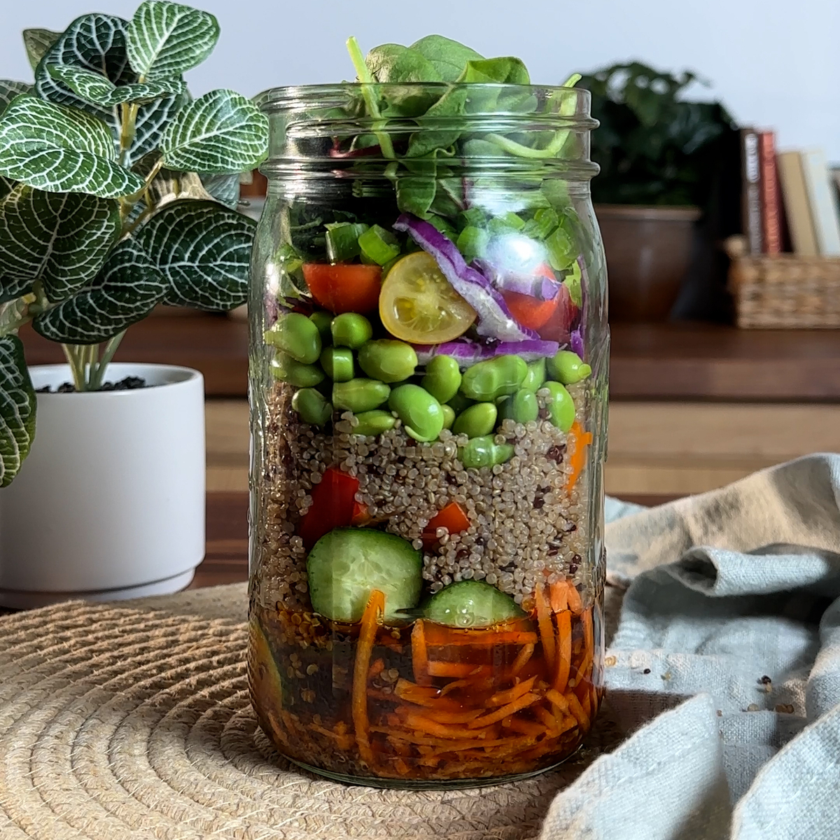 A mason jar salad recipe made with a dressing using Lee Kum Kee sauces.