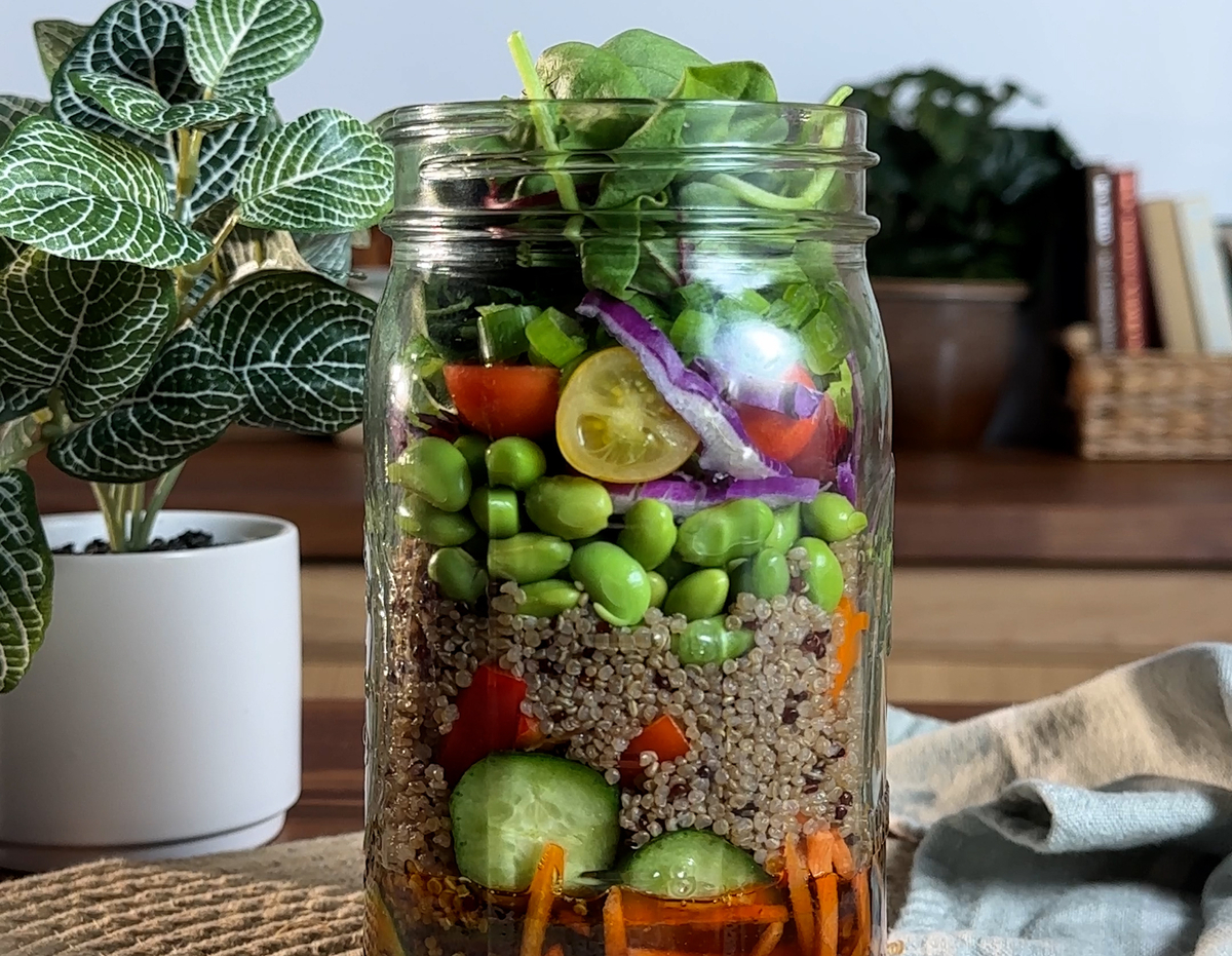 A mason jar salad recipe made with a dressing using Lee Kum Kee sauces.