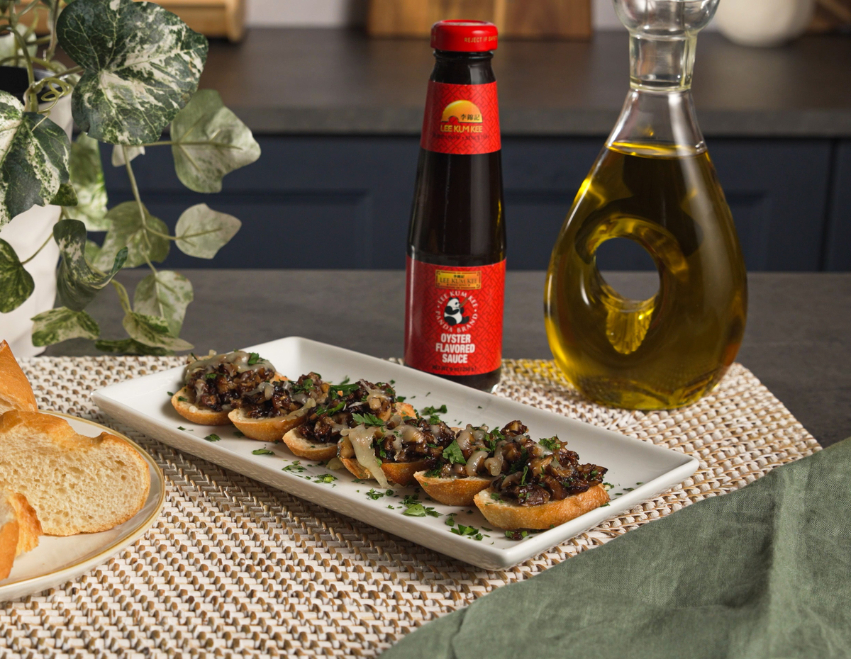 A mushroom and gruyere mini toast bites recipe featuring Lee Kum Kee Panda Brand Oyster Sauce.