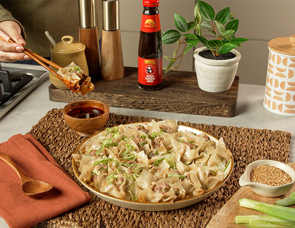 An easy no fold dumplings recipe for pork dumplings, flavored with oyster sauce, and a soy-chili crisp dipping sauce.