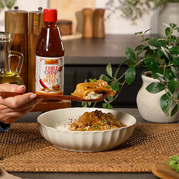 A one pan dumpling bake recipe made with a coconut curry sauce and served over rice.