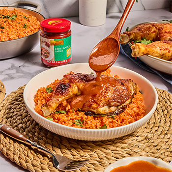 A Peri Peri Chicken recipe served over Jollof Rice.