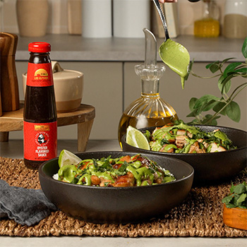 A Peruvian style chicken and rice bowl recipe topped with aji verde sauce.