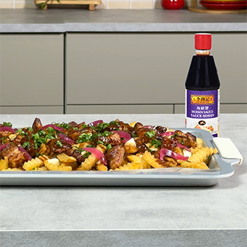 A poutine recipe topped with hoisin marinated pork belly.