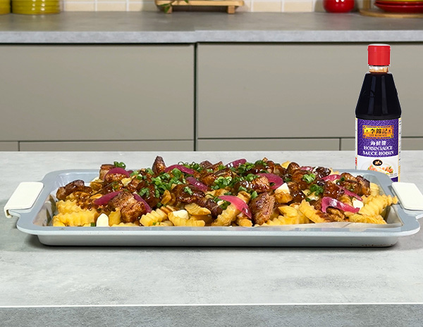 A poutine recipe topped with hoisin marinated pork belly.