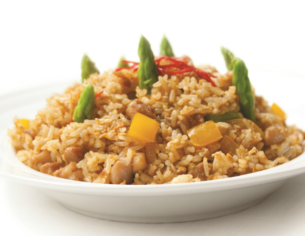 Fried Rice with pork and asparagus shoots served in a white bowl