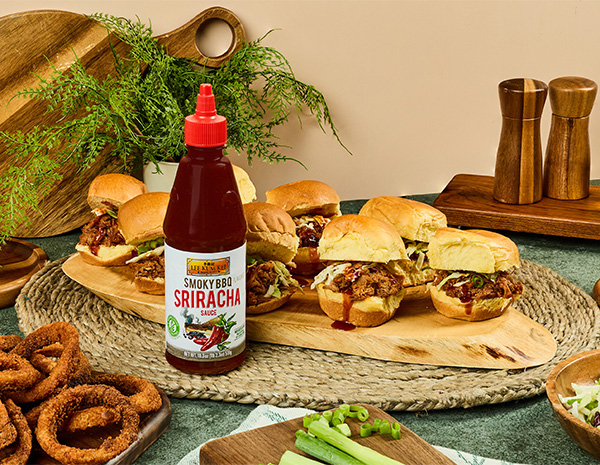 A pulled pork sliders recipe made in the slow cooker and infused with spicy smoky bbq sauce.
