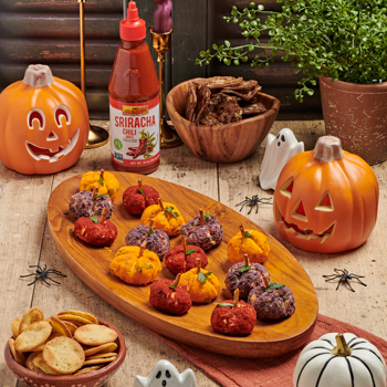 A Pumpkin Shaped Cheeseballs recipe perfect for Halloween, with a spicy kick from Lee Kum Kee Sriracha Chili Sauce.