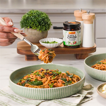 A quick pasta recipe done in under 15 minutes, made with tinned fish and drizzled with cilantro chili crisp.