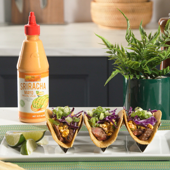 Three prepared Asian-style steak street corn tacos from Lee Kum Kee’s recipe served with Sriracha Mayo