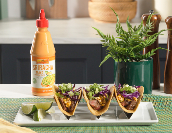 Three prepared Asian-style steak street corn tacos from Lee Kum Kee’s recipe served with Sriracha Mayo