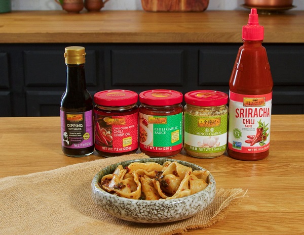 A bowl of biang biang noodles surrounded by Lee Kum Kee sauces and seasonings