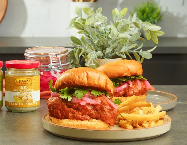 Two chicken tikka masala sandwiches plated with fries alongside Lee Kum Kee ingredients