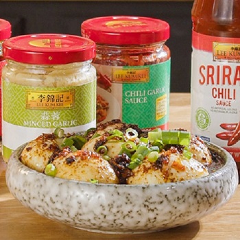 Spicy garlic eggs in a serving dish, alongside the Lee Kum Kee sauces used in the egg boil recipe