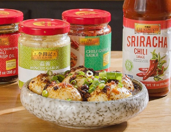 Spicy garlic eggs in a serving dish, alongside the Lee Kum Kee sauces used in the egg boil recipe