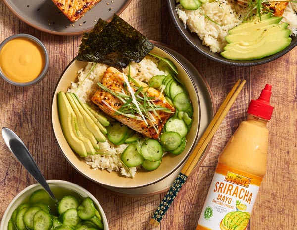 Servings of sriracha mayo salmon in bowls alongside Lee Kum Kee sauce