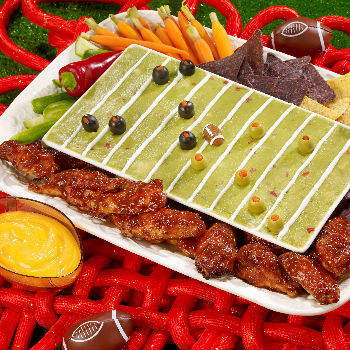 Sriracha hot wings with hoisin displayed on a football-themed serving platter