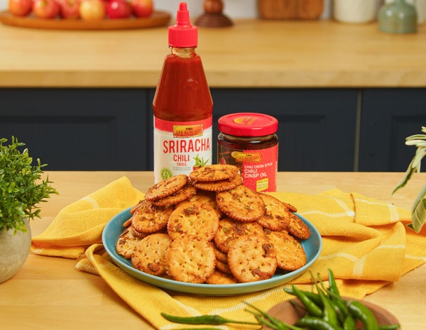 Sweet and spicy cracker bite recipe made on a serving plate, alongside the Lee Kum Kee sauces used in the dish