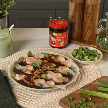 A rice paper cheung fun recipe with a Lee Kum Kee Chili Crisp dipping sauce.