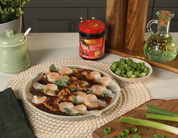 A rice paper cheung fun recipe with a Lee Kum Kee Chili Crisp dipping sauce.
