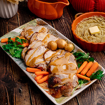 A roasted turkey breast recipe served with a honey soy glaze and gravy.