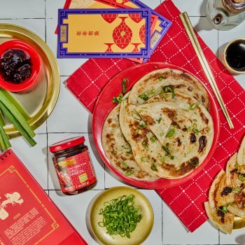 A scallion pancakes recipe for Lunar New Year with Lee Kum Kee Chili Crisp Oil for dipping.