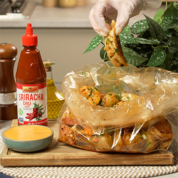 A seafood boil recipe with added dumplings and made with sriracha sauces.