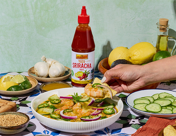A shrimp aguachile recipe with cucumber and red onion, made with Yuzu sriracha sauce.