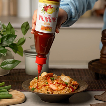 A shrimp fried rice recipe topped with Yuzu Sriracha Sauce.