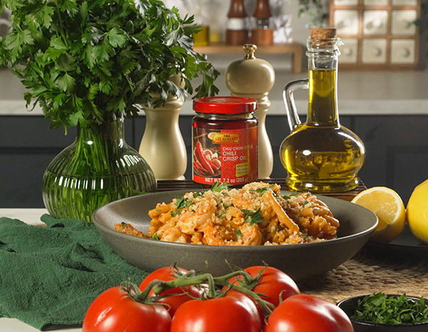 A spicy shrimp pasta recipe in a creamy tomato sauce made with Lee Kum Kee chili crisp.