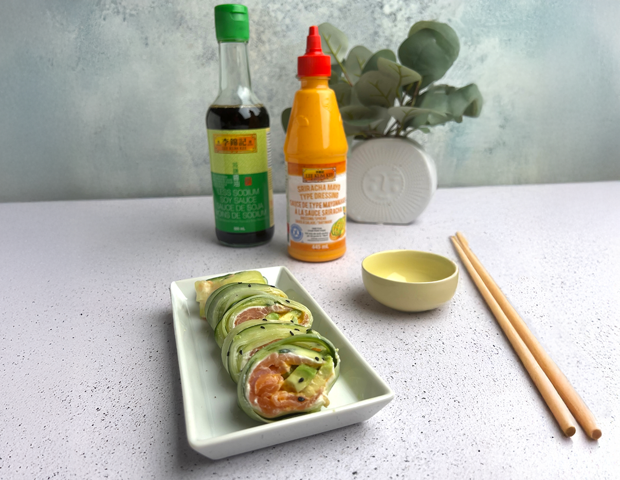 A smoked salmon roulade on cucumber recipe with Lee Kum Kee sauces for serving and/or dipping.