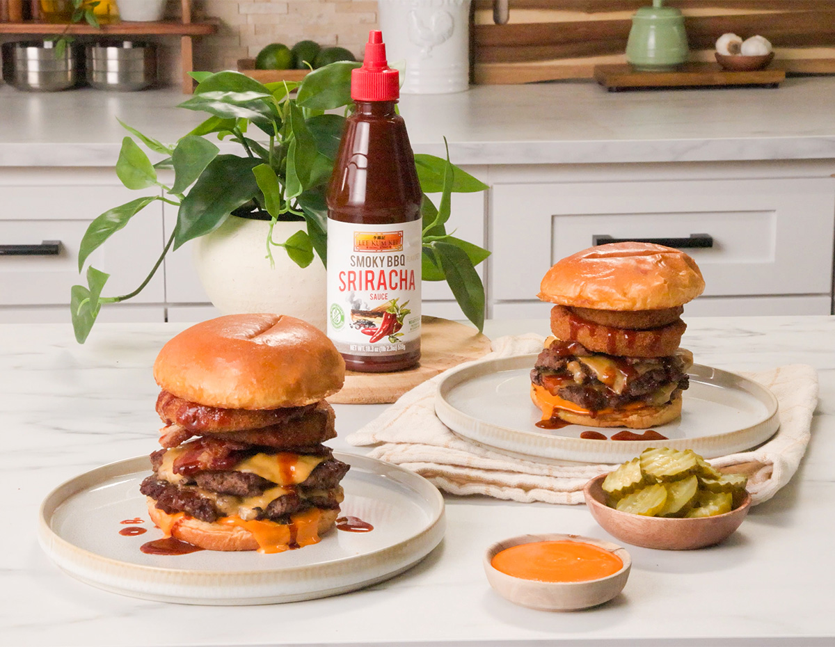 A smoky BBQ smashburger recipe with bacon, crispy onions, sriracha mayo, and smoky bbq sriracha sauce.
