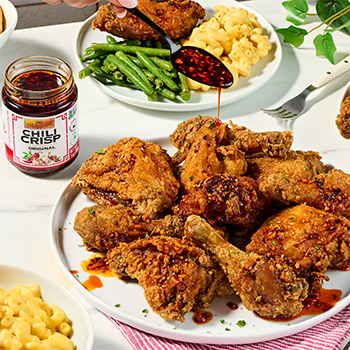 A spicy buttermilk fried chicken recipe topped with chili crisp.