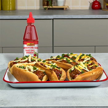 A chili cheese dogs recipe with a spicy addition of Sriracha chili sauce.