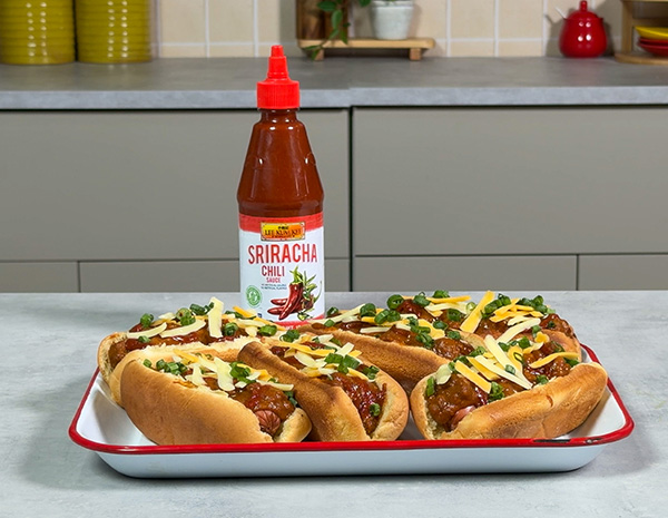 A chili cheese dogs recipe with a spicy kick of Sriracha Chili sauce.
