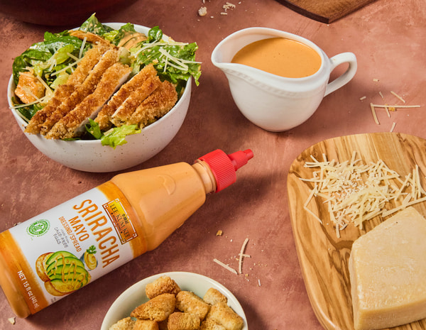 A spicy crispy chicken caesar salad recipe made with Lee Kum Kee Sriracha sauces. 