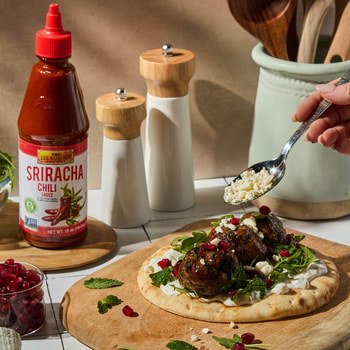 A spicy lamb meatballs recipe in a pita with Lee Kum Kee Sriracha.