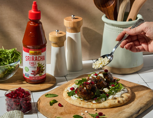 A spicy lamb meatballs recipe in a pita with Lee Kum Kee Sriracha. 