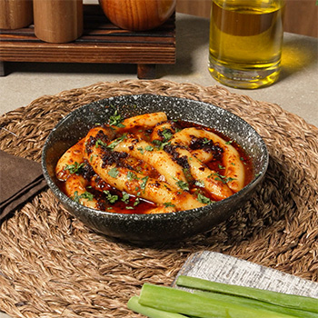 A spicy potato noodles recipe served with a flavorful chili sauce.