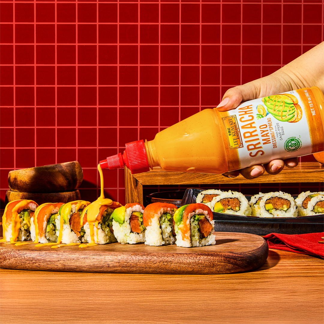 A spicy tuna roll topped with fresh fish, avocado, and Lee Kum Kee Sriracha Mayo.