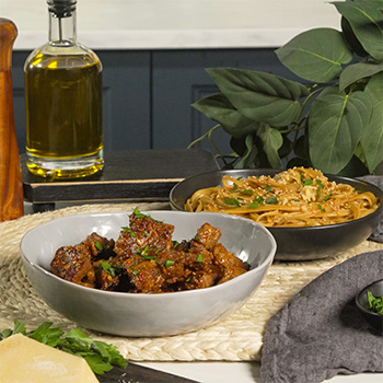 A steak bites recipe coated in a spicy garlic parm sauce.