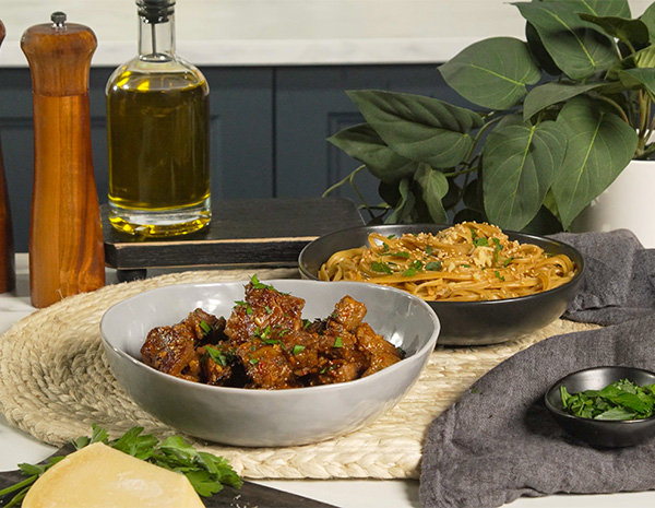 A steak bites recipe coated in a spicy garlic parm sauce.