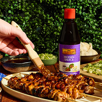 A sweet chili chicken skewers recipe brushed with a glaze of hoisin and chili crisp hot honey.