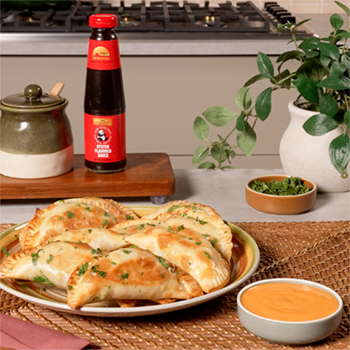 A turkey pot pie filling stuffed inside empanadas with Sriracha Mayo for dipping.