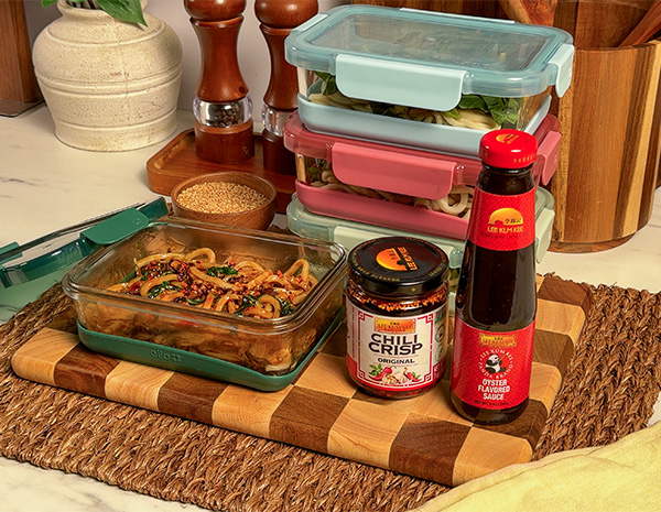 An udon meal prep recipe made with oyster sauce and topped with chili crisp.