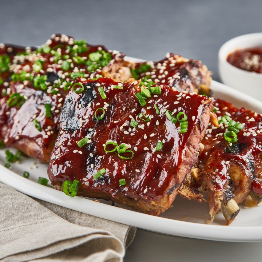 A barbecue pork ribs recipe with hoisin sauce topped with sesame seeds.