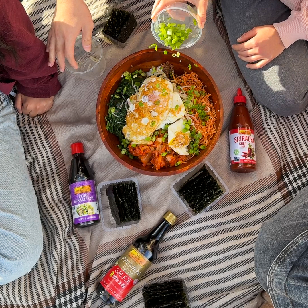 A bibimbap picnic meal with friends featuring Lee Kum Kee Sauces.