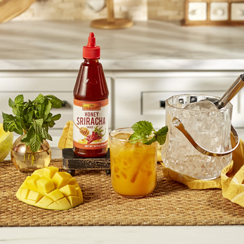 A bourbon smash cocktail recipe made with Lee Kum Kee Honey Sriracha.